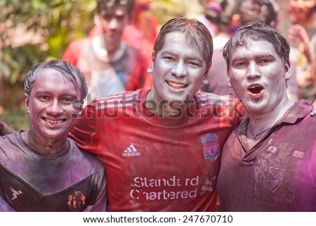 Close-up of three young boys face painted with silver color on Indian color festival called HOLI on March 17, 2014, Mumbai Maharashtra India South East Asia