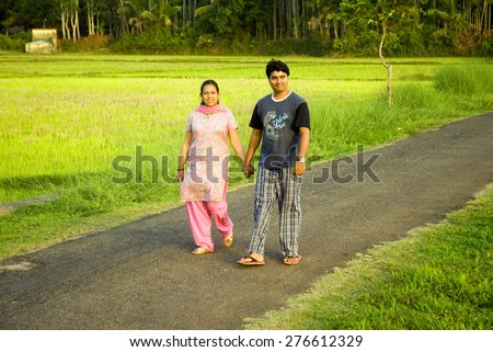 Couple on evening walk, Trichur, Kerala, south India, Asia