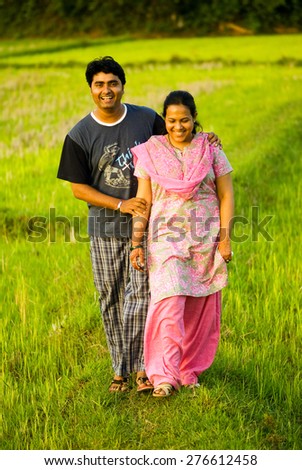 Couple on evening walk, Trichur, Kerala, south India, Asia