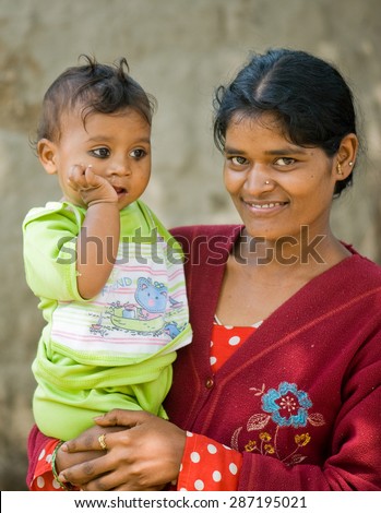 MAHARASHTRA, INDIA SEPTEMBER 22, 2011: Indian rural mother and child, SEPTEMBER 22, 2011, rural village, Salunkwadi, Ambajogai, Beed, Maharashtra, India