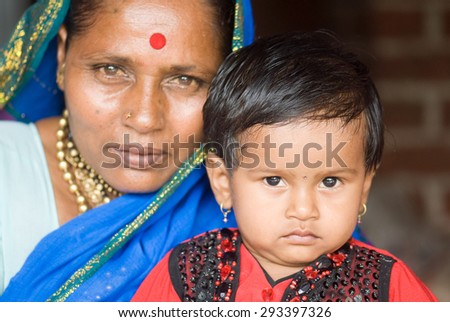 Indian rural baby girl with grand mother closeup Salunkwadi, Ambajaogai, Beed, Maharashtra, India, South East Asia