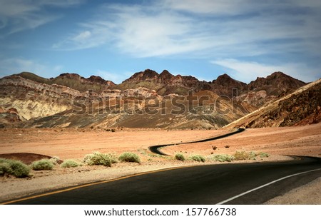 Lonely Road Through Mountains in Death Valley National Park, California, USA