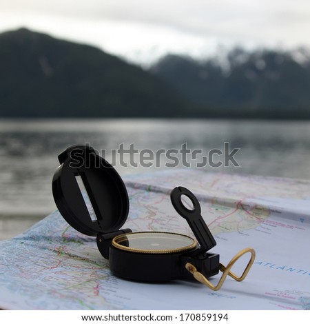 Navigation over sea with compass and map at Chile Fjords