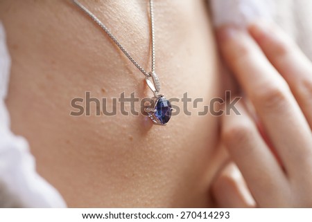 Woman\'s decollete with a luxury jewelry