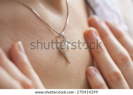 Woman's decollete with a luxury jewelry