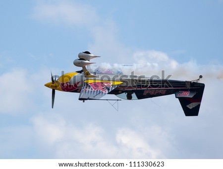 PLZEN, CZECH REPUBLIC - AUGUST 25: Acrobatic plane Extra 300SR piloted by Petr Sonka in  Air Show at airfield in Plzen - Line, Czech Republic on August 25, 2012