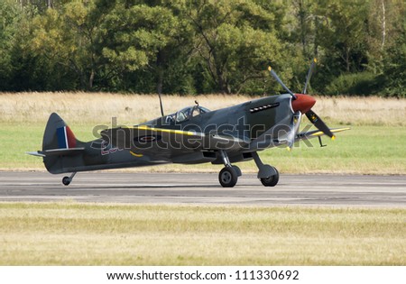 PLZEN, CZECH REPUBLIC - AUGUST 25: Fighter Spitfire XVI piloted by Stephen Stead in  Air Show at airfield in Plzen - Line, Czech Republic on August 25, 2012