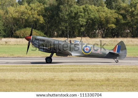 PLZEN, CZECH REPUBLIC - AUGUST 25: Fighter Spitfire XVI piloted by Stephen Stead in  Air Show at airfield in Plzen - Line, Czech Republic on August 25, 2012