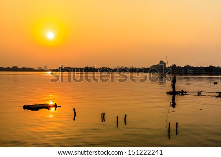 Fishing At Sunset on the West lake, Hanoi, Vietnam