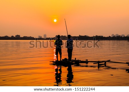 Fishing At Sunset on the West lake, Hanoi, Vietnam