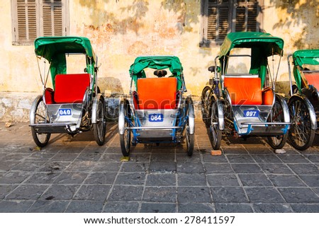 HOI AN, VIETNAM - March 14 : Cyclo parked on the side street at Hoi An, Vietnam on March 14, 2014