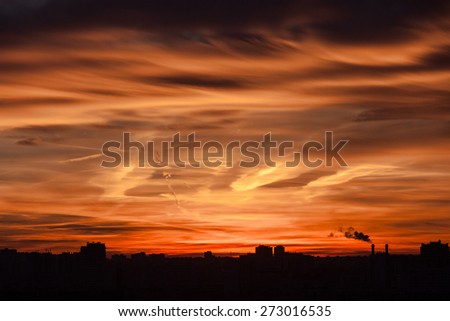 Sunset with industrial skyline, fire sky.