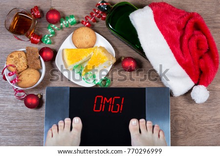 Female feet on digital scales with sign 