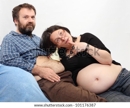 Funny picture of crazy family. Pregnant woman and her fatty husband.