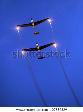 ST. WOLFGANG, AUSTRIA - JULY 7: Two Czech gliders L 13 Blanik from The Blanix Glider Team during a famous nightshow in Air Challenge on July 7, 2012 in St. Wolfgang.