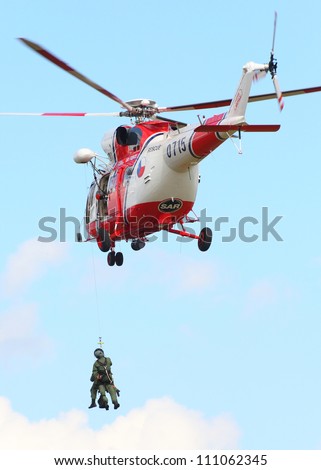 PILSEN, CZECH REPUBLIC - AUGUST 25: Modern polish rescue helicopter W-3A Sokol and rescue team, Pilsen Aeronautical Days on August 25, 2012 in Pilsen , Czech Republic.