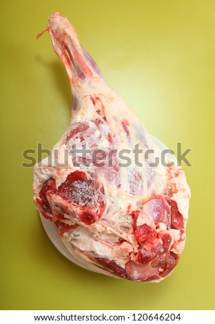Lamb meat on a green background. Healthy dietetic food. Source of proteins from organic farm.
