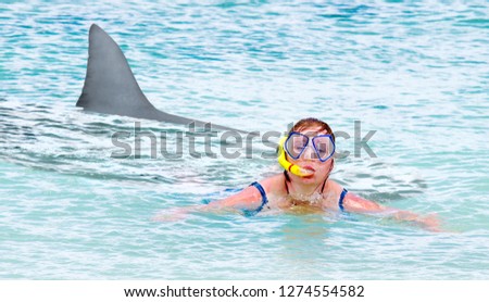 Terrified swimmer fleeing from white shark. Summer holidays risks. Travel and life insurance theme.