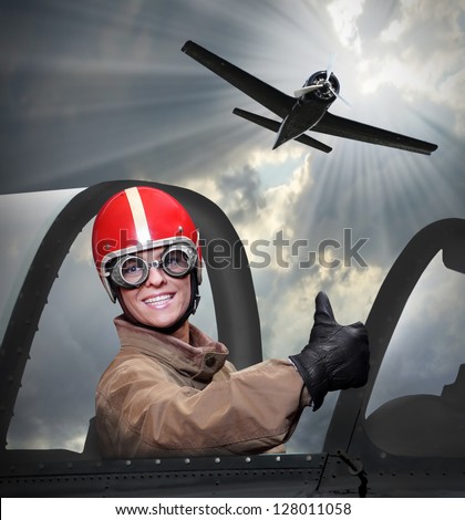Happy pilot in a cockpit of a vintage plane.