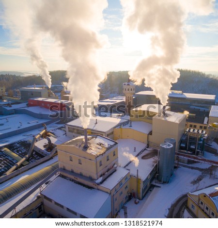 Aerial view to smoking stacks from industrial area near Pilsen. Air pollution and climate change theme. Power and fuel generation in Czech Republic, European Union.