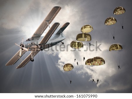 Retro style picture of the biplane with skydivers Retro style picture of the biplane with skydivers