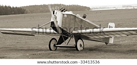 Historic plane on the airfield - - vintage photography