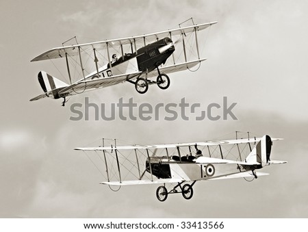 Two historic biplanes on the sky - vintage photography