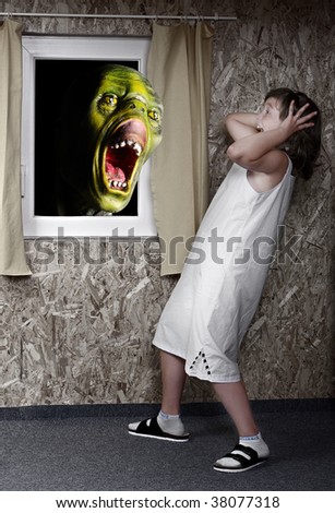 Screaming green zombie and fright little girl - green wooden head is unauthorized homemade work Great for Halloween brochures and advertisements