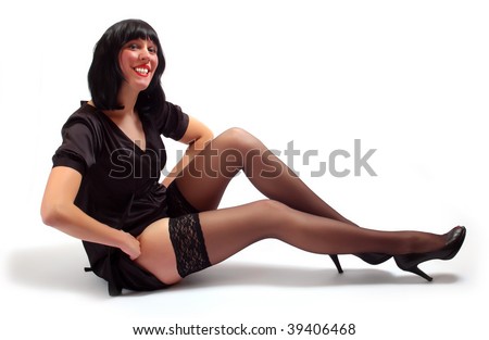 stock photo Beautiful brunette business woman in black nylons sitting on a