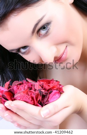 Sexy fashion portrait with flowers - Beautiful portrait of a young sexy woman smelling the flowers.