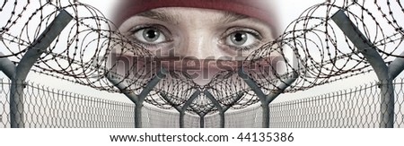 Fence with a barbed wire and veiled face. Conceptual image - human rights concept