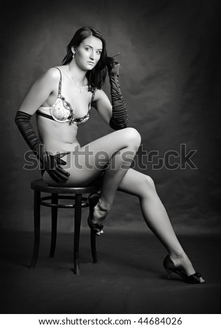 Sitting beautiful girl - monochrome photography. Great for calendar and Valentine advertising.