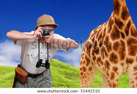 Funny picture. Crazy wildlife photographer and giraffe. Telephoto style - shallow DOF. Great for calendar.