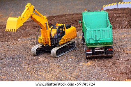 Green dumper and yellow excavator on a road building. Homemade RC model - plastic kit (  scratchbuild 1 : 32 scale)