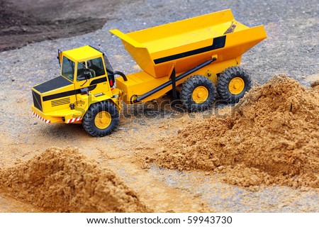 Yellow dumper on a road building. Homemade RC model - plastic kit (  scratchbuild 1 : 32 scale)
