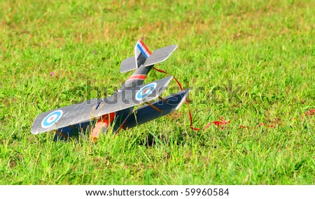 Crashed radio control aircraft on a airfield. Homemade product.