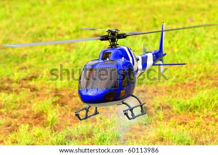 Flying helicopter (radio controled scale-model 1:24 scale) Teleobjective shot with shallow DOF.