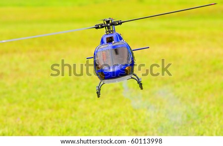 Flying helicopter (radio controled scale-model 1:24 scale) Teleobjective shot with shallow DOF.