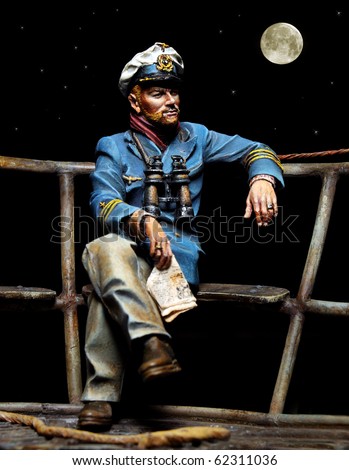 Old sailor sitting on a boat deck. Unauthorized homemade work (plaster 