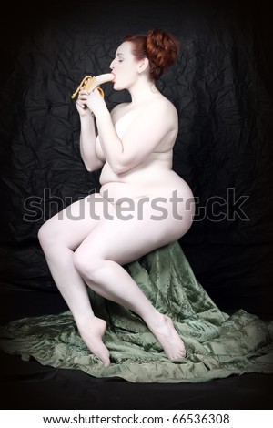 Naked overweight woman eating fresh ripe bananas on black background. Funny image - Fine Art style. Great for calendar