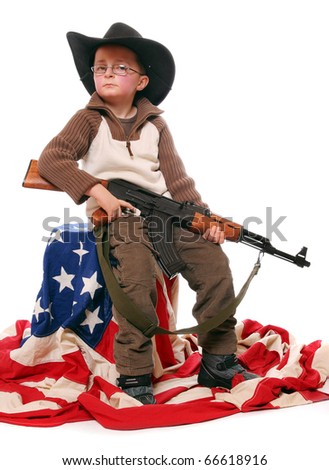 stock-photo-the-young-american-patriot-with-assault-rifle-and-cowboy-hat-sitting-on-a-american-flag-66618916.jpg