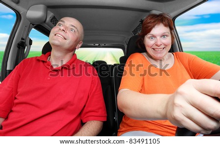 Happy mentally handicapped man and his female nurse ridding on a vacations.