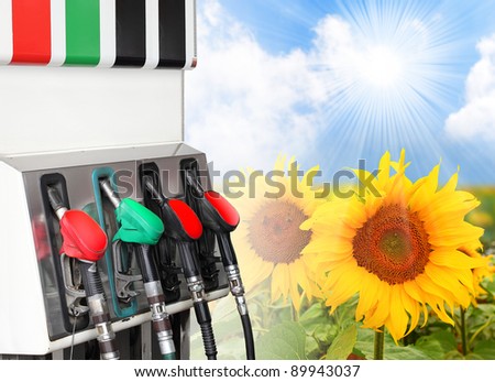 Gas station and sunflowers field. Ecology concept.