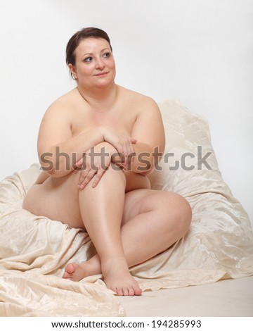 Overweight woman in the bedroom.