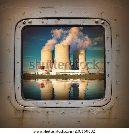 Nuclear power plant on the coast wiew from steel window. Ecology disaster concept.