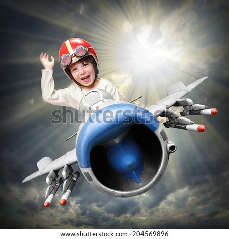 Happy little pilot flying in retro jet fighter Happy little pilot flying in retro jet fighter