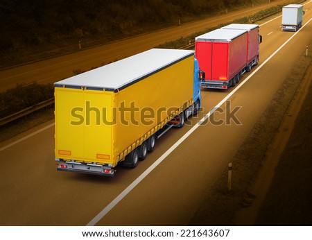 The trucks on the highway.