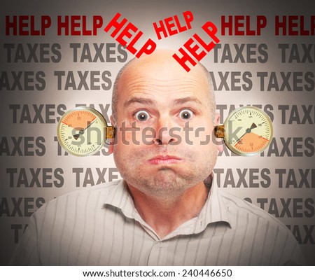 Frustrated and stressed businessman under pressure. High taxes concept.