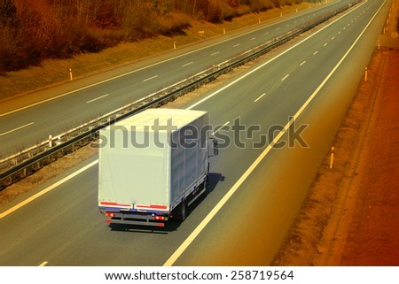 White truck on the highway. Retro style picture.