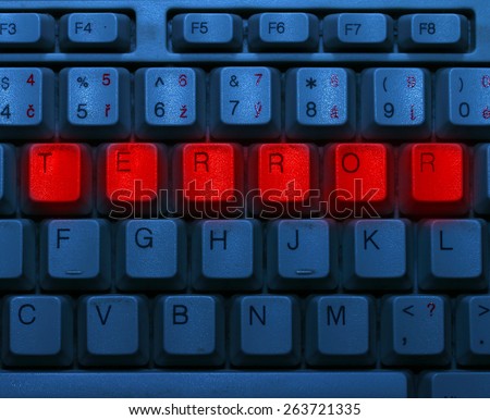 Dirty blue keyboard with red notice Terror. Terrorism online concept.